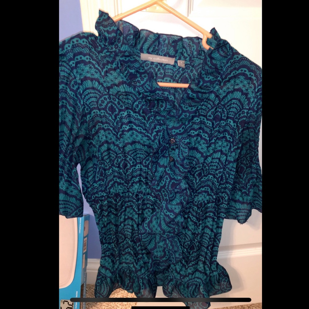 Navy blue/green ruffled blouse.